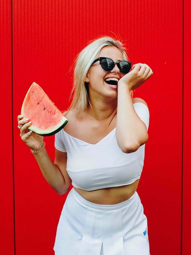Girl holding and eating watermelon